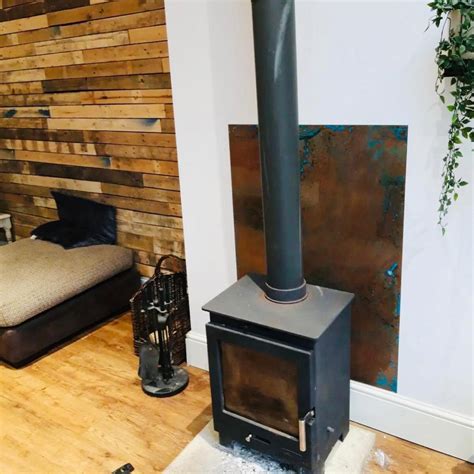 sheet metal wood burning stove|fireproof backing for wood stove.